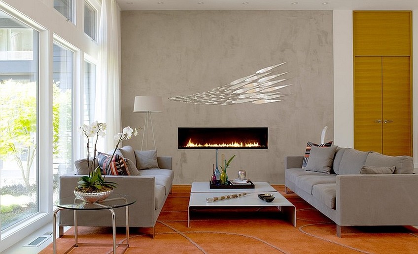 Usual sleek contemporary fireplace and concerete wall become the focal point in the room