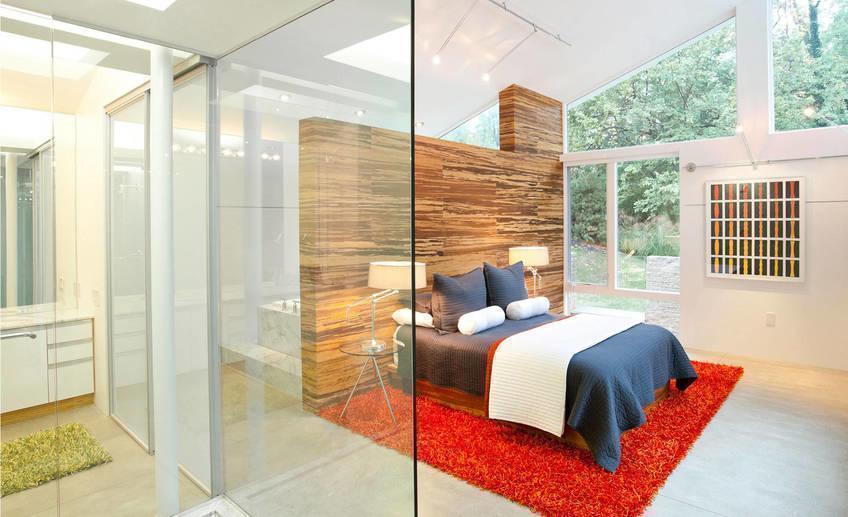 Modern master bedroom renovated garden house design with white interior color decorating ideas wood wall divider red carpet tiles and glass nightstand table