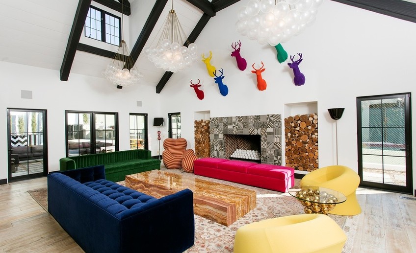 Eclectic living room with bubble chandelier and stone fireplace i g isxzhxgplrvoe90000000000 1ey1n